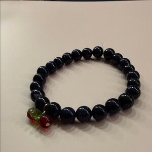 Elegant Black Beaded Bracelet with Red Charm